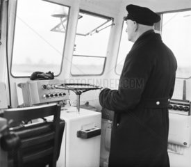 Captain at the wheel of the ‘Catherine’  Gravesend  31 January 1961.