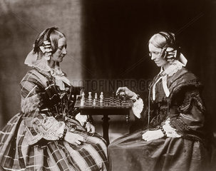 The Misses Lutwidge playing chess  c 1858.