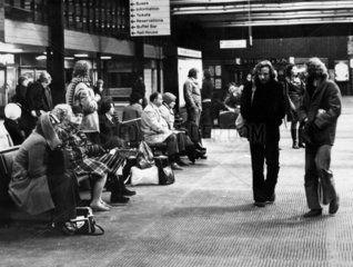 Pasengers waiting for a delayed train  Manchester Piccadilly  4 January 1976.
