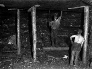 Testing the roof in a mine shaft  Ramrod Hall Pit  Staffordshire  c 1890s.