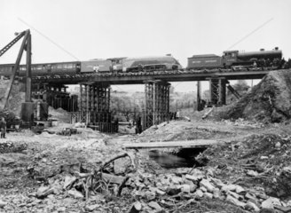 A temporary bridge being tested by a heavy