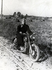 Woman on a motorbike  c 1955.
