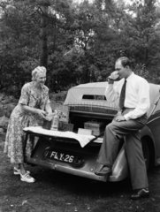 Couple having a picnic  c 1950.