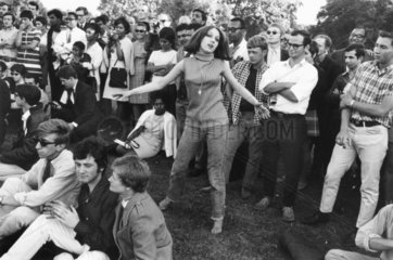 Woman dancing at a festival  Hyde Park  London  1967.