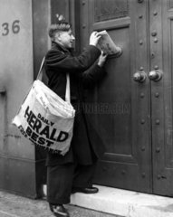 Newspaper boy delivering the 'Daily Herald'  13 December 1935.
