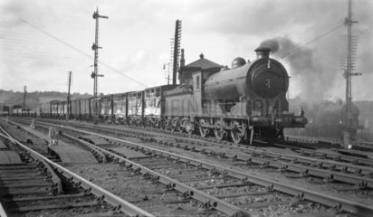 NBR steam locomotive hauling freight  c 1900s.