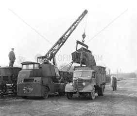 Workers unloading stone  Stansted goods yard  Essex  January 1954.