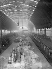 Milk churns and mail sacks at Paddington Station  London 1908.