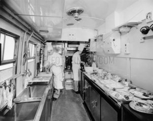 Chefs prepare passengers' lunch in British Railways kitchen car  March 1951.