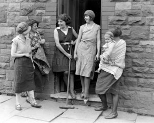 Miners' wives and children outside their houses  23 June 1931.