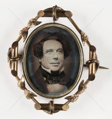 Small portrait of a man contained in a brooch  mid-late 19th century.