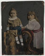 Tintype portrait of two children  c 1880.
