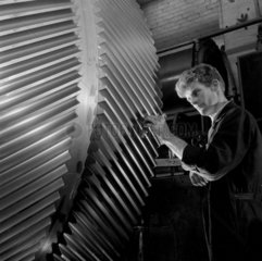 An engineer checks a large gear wheel  Huddersfield  1959.