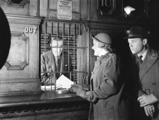 Passengers buying train tickets  1936.