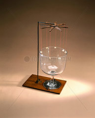 Instrument to demonstrate the vibration of a glass bell  early 19th century.