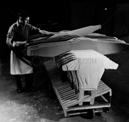 Man with sweaters and cardboard stiffeners at Lyle and Scott  1953.