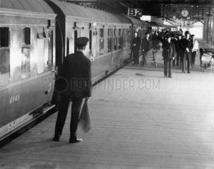 Station guard on platform  Euston station  London  1938.