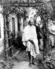Mahatma Gandhi posing under a rustic arch  England  1931.