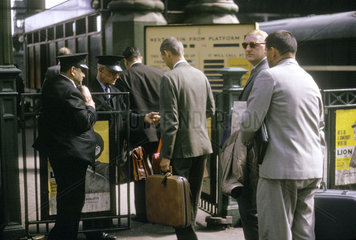 Passengers passing through ticket barrier  Liverpool Street station  1963.