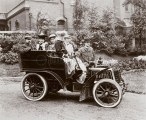 C S Rolls beside a 10 hp Panhard motor car  c 1900.