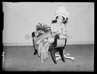 Woman under a hairdrier  1930s.