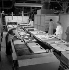 A team lay down Enamel sections of Creda cookers in drying oven.  1959.