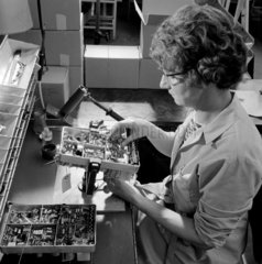 Woman wires a skeleton frame for radio set at MEL  Crawley   1964.