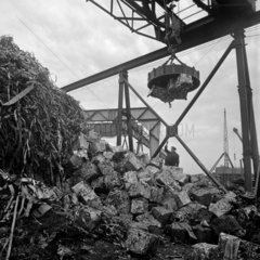 Scrap metal yard with magnetic crane and gaffer  Sheffield   1966.