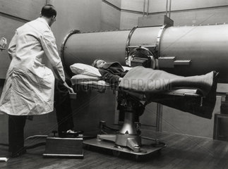 An x-ray being taken at Bartholomew's Hospital in London  c 1930s.