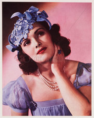 Woman modelling a hat  c 1940s.