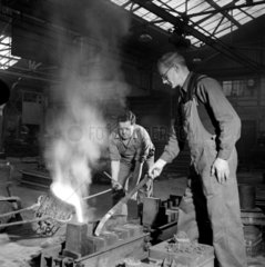 Men in foundry casting parts for diesel locomotives  English Electric  1958