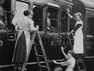 Women cleaning a train carriage  c 1918.