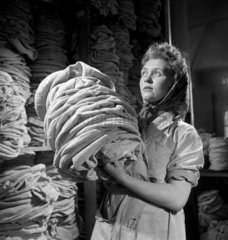 Woman carrying Kangol berets  Cleator  Cumbria  1948.