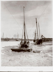 ‘Small sailing vessels grounded at low tide'  Chiswick  London  1901.