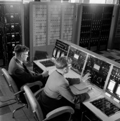 Two engineers at console of MARS computer  APD laboratories  1959