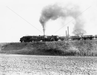 Freight train hauled by a Garratt locomotive  Worcestershire  March 1950.