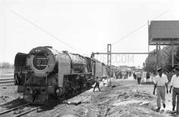 Steam locomotive and passenger train  Orange River  South Africa  1968.