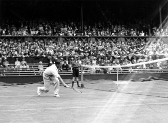 Tennis player Fred Perry in action at Wimbledon 1931.