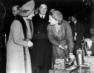 Queen Elizabeth with a munitions worker  1941.