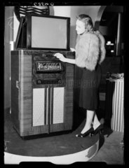 Woman demonstrating a television receiver  Radiolympia  London  1938.