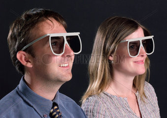 Man and woman wearing Imax 3D glasses  2003.