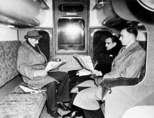 Passengers in the lower deck compartment of