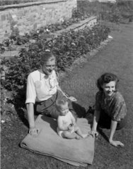 Young family in a garden  1948.