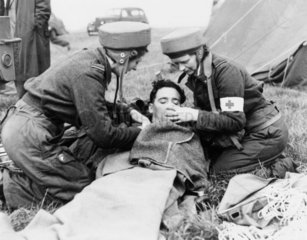 Royal Air Force para-nurses attending an air crash victim  7 October 1948.