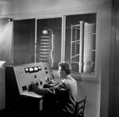 Operator at console with high voltage discharge tested  AEI  Rugby 1957.
