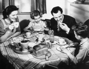 A family having tea  1940s.