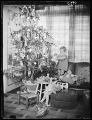 Child with a Christmas tree  1936.