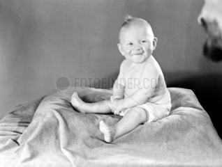 Baby on a cushion  c 1950.