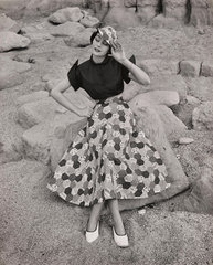‘Woman in patchwork skirt and hat'  c 1960.
