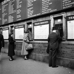 Passengers buying tickets at Victoria Station  London  1951.